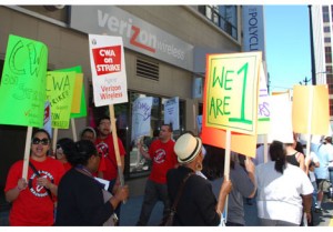 Dozens of supporters of Verizon strikers picket in downtown Seattle on Aug. 19, 2011. 