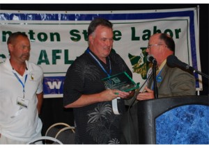 Dan Coffman, President of ILWU Local 21 in Longview, accepts the 2012 Mother Jones Award that was presented to his union.