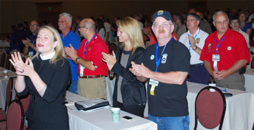 Lily Wilson-Codega of Teamsters Joint Council 28 (center, between the guys with a red shirt and the baseball cap) apparently thinks the new lyrics to "Come Together" are pretty dang funny.