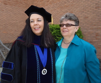 Mary Grace Gainer with her mother after doctoral ceremonies.