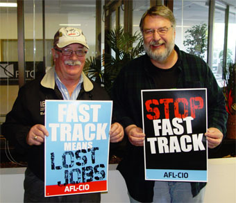 Bob Guenther of IBEW 77 and the Thurston-Lewis-Mason Central Labor Council and Jeff Johnson, President of the Washington State Labor Council, joined in the April 18 neighborhood canvass in Olympia against Fast Track.